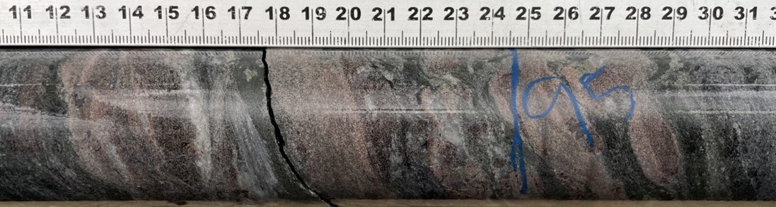 Photo showing the garnet-sericite-chlorite alteration from drill hole D2V-22-57 at 95m. Garnets reach up to 3cm in diameter.